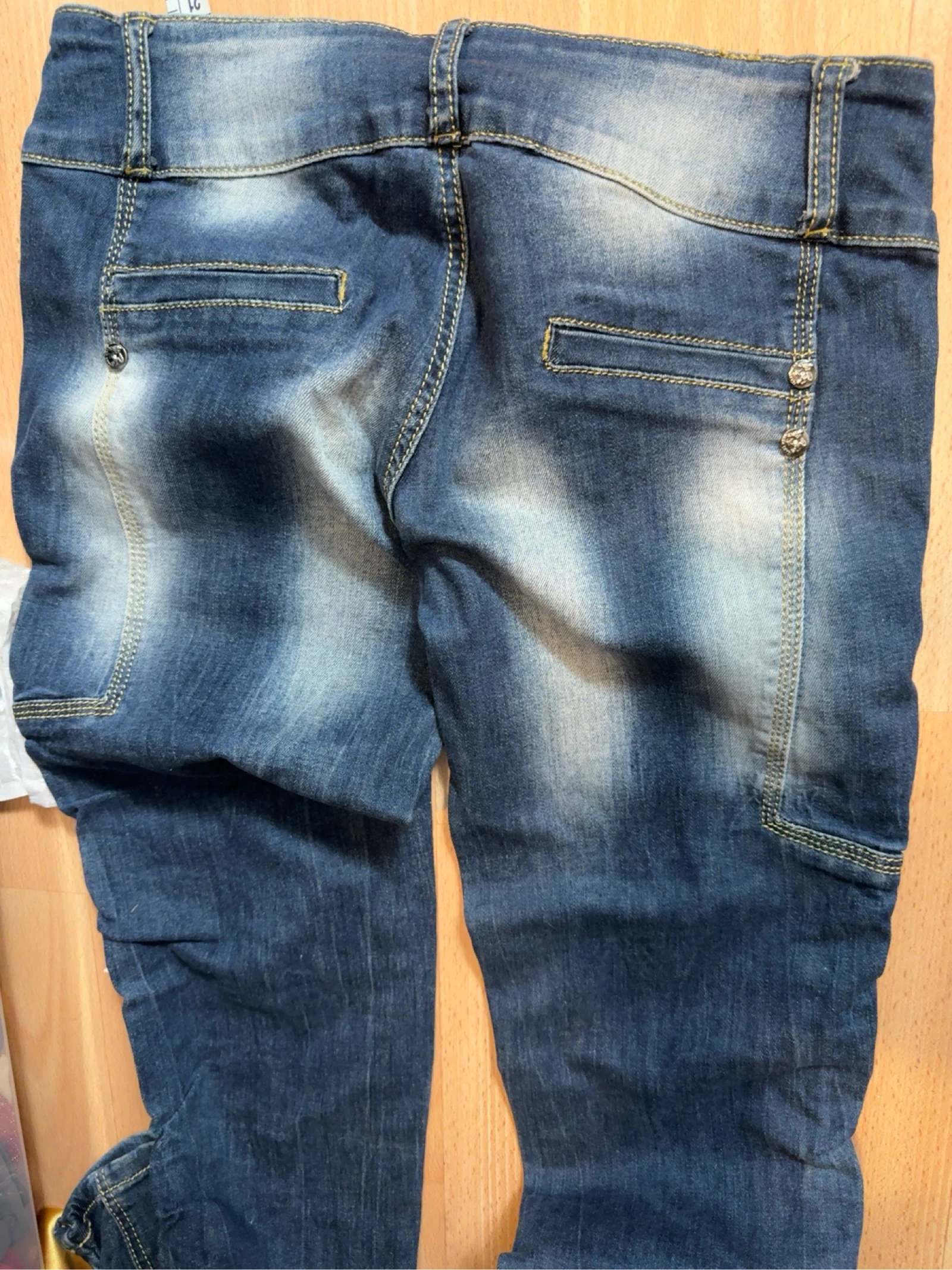 Blue washed effect jeans with side pleats – photo 6